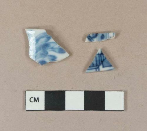 Blue hand painted porcelain body sherds; blue hand painted porcelain rim sherd