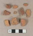 Brick fragments; unglazed, undecorated redware body sherd