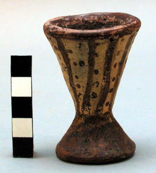 Small pottery cup with base