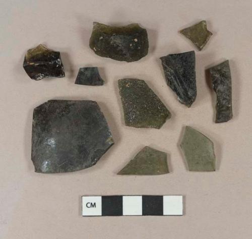 Dark olive green vessel body fragments, likely bottle fragments