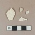 Undecorated whiteware vessel body fragments, white paste; White stoneware vessel rim fragment, white paste, weathered; 1 white undecorated tin-glazed earthenware vessel body fragment, buff paste