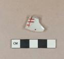 Black and red on white handpainted porcelain vessel body fragment, white paste