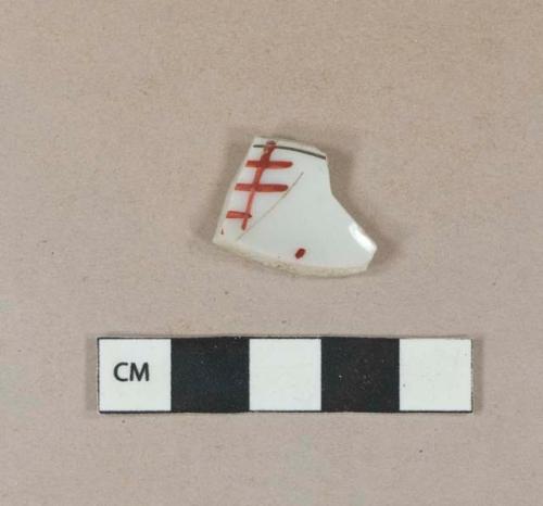 Black and red on white handpainted porcelain vessel body fragment, white paste