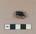 Black lead glazed redware vessel base fragment, likely jackfield type