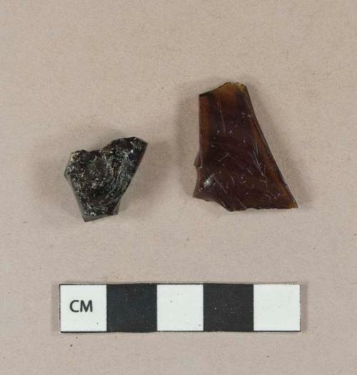 Dark amber glass vessel body fragments, likely bottle fragments