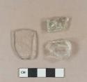 Colorless vessel glass fragments; 1 light aqua glass fragment, unidentified