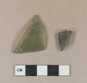 Olive green vessel glass body fragments, likely bottle