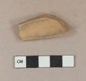 Undecorated unglazed redware vessel body fragment