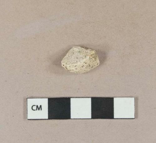 White plaster fragment, degraded