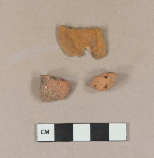 Red brick fragments; 1 Reddish mudstone fragment, ferrous staining