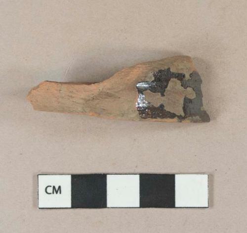 Undecorated lead glazed redware base sherd