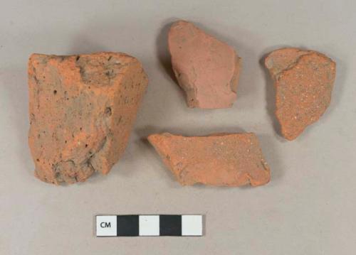 Brick fragments; unglazed, undecorated redware body sherd