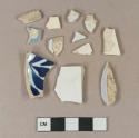 Undecorated creamware body sherds; undecorated pearlware body sherds; undecorated whiteware body sherd; unidentified refined earthenware body sherd, missing all glaze; undecorated tin glaze earthenware body sherd; blue decorated refined earthenware body sherd; blue hand painted pearlware body sherds