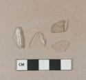 Colorless bottle glass fragments; colorless glass fragment with folded rim