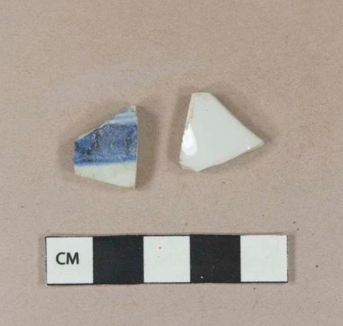 Undecorated porcelain body sherd; blue hand painted porcelain body sherd