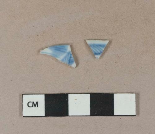 Blue hand painted porcelain rim sherds; two sherds crossmend