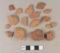 Brick fragments; unglazed, undecorated redware body sherds