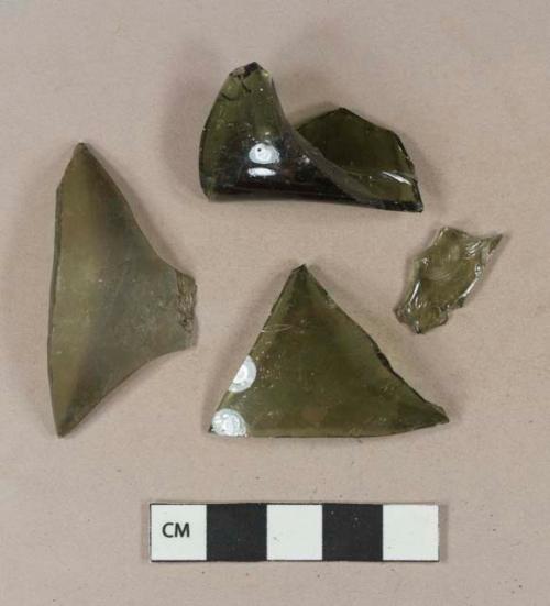 Olive green bottle glass fragments, including one base fragment