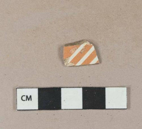 Orange annular banded factory decorated whiteware body sherd