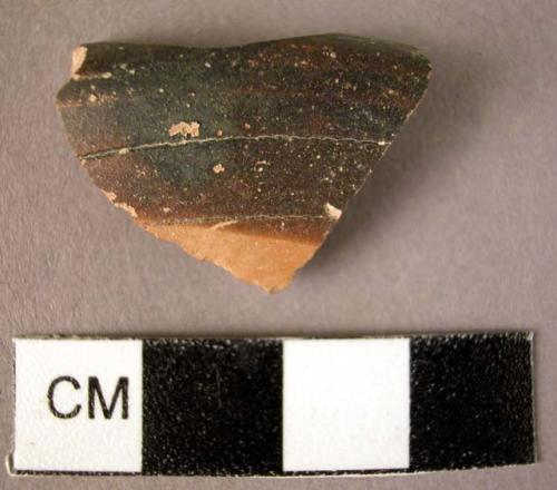 Rim of pottery bowl fragment - dark glaze band on rim