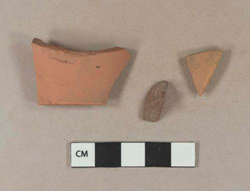 Brick fragment; unglazed, undecorated redware rim sherd; unglazed, undecorated redware base sherd