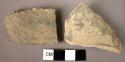 2 potsherds - "Urfirnis" glaze slip