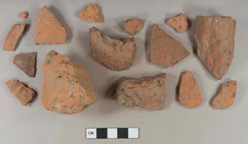 Brick fragments; unglazed, undecorated redware base sherd