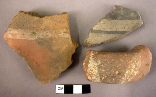2 potsherds; 1 handle fragment - imitation of Middle Minoan ware