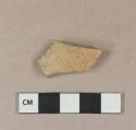 Buff bodied undecorated brown salt glaze stoneware body sherd