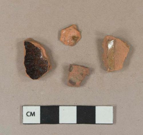 Undecorated lead glazed redware body sherds; slip decorated lead glazed redware body sherd