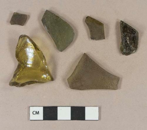 Olive green bottle glass fragments; yellow bottle glass fragment