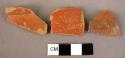 Rim potsherd; 2 potsherds - Mycenaean red glaze