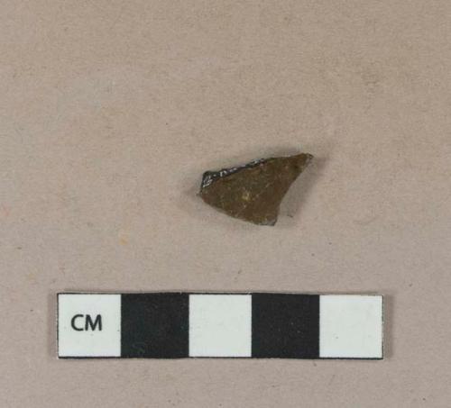 Burned, undecorated lead glazed redware body sherd