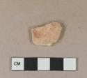 Unglazed, undecorated buff-colored earthenware body sherd