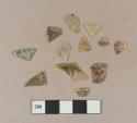 Heavily patinated flat glass fragments, possibly aqua or yellow