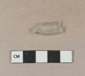 Colorless glass fragment with folded rim, possible stemware base fragment