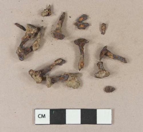 Cut or wrought iron tack fragments; unidentified iron fragments, likely originally from tacks