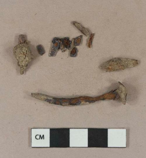 Cut or wrought iron nail fragments; unidentified iron fragments, likely originally from nail