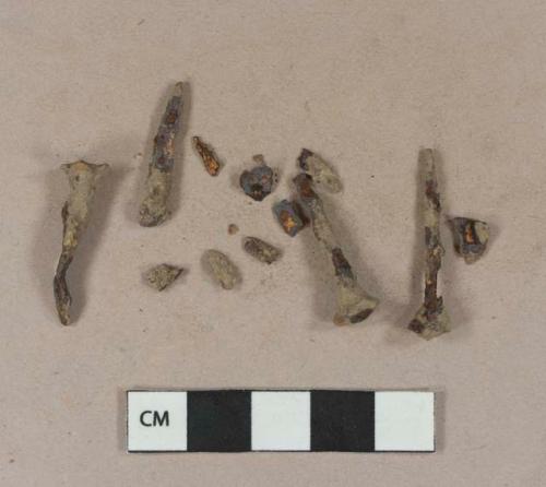 Cut or wrought iron nail fragments; unidentified iron fragments, likely originally part of nails