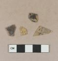 Yellow flat glass fragments, heavily patinated