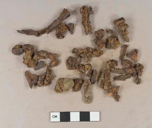 Iron nail fragments, some cut or wrought; unidentified iron fragments, likely originally from nails