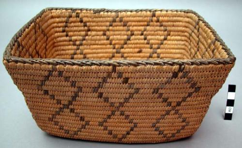 Rectangular basket, coiled. Geometric designs.