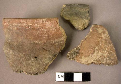 2 rim potsherds; 1 potsherd - plain brownish ware - unburnished