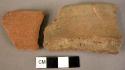 Rim potsherd; potsherd - plain red ware, unburnished