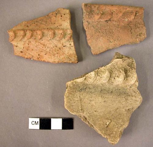 1 rim sherd, 2 potsherds, all coarse ware, plastique decoration