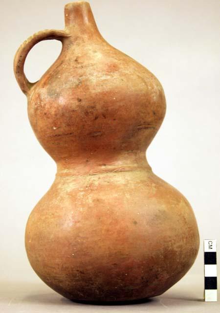 Pottery jar, handle on side, constricted in center, red