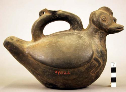 Pottery jar mouth in center of cross handle, bird shaped