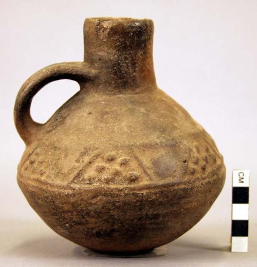 Pottery jar, handle on side, black, stamped ornament