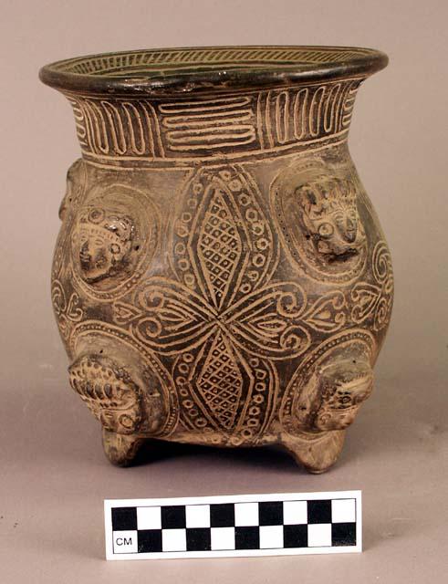 Incised and adorno-decorated tripod pottery jar