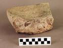 Ground stone metate fragment